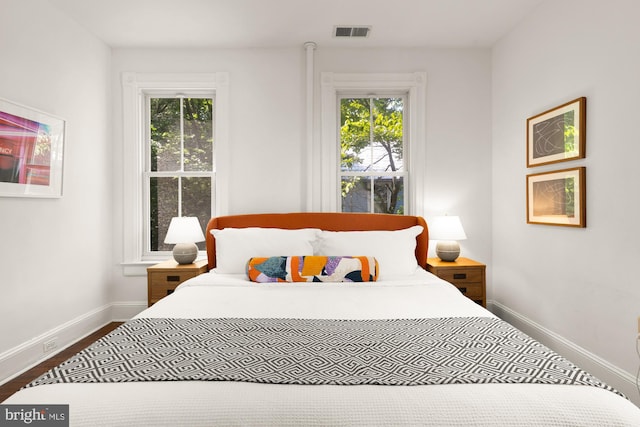 6914 6th St NW, Washington, DC 20012 - bedroom featuring baseboards and dark wood-style floors