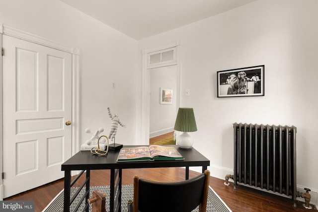 6914 6th St NW, Washington, DC 20012 - office space with radiator, dark wood finished floors, and baseboards