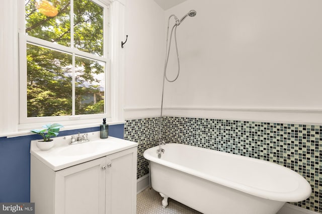 6914 6th St NW, Washington, DC 20012 - bathroom with a soaking tub, vanity, and tile patterned flooring