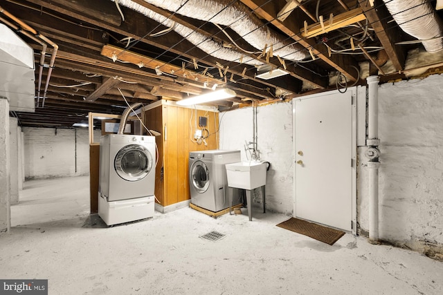 6914 6th St NW, Washington, DC 20012 - unfinished basement with separate washer and dryer and a sink