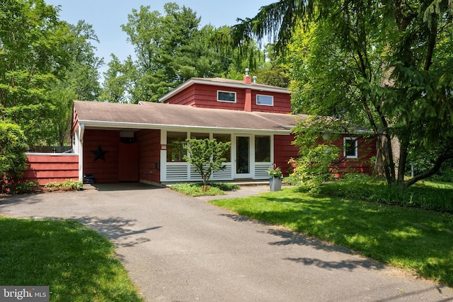 84 Cuyler Rd, Princeton, NJ 08540 - view of front of property with driveway, a carport, a shingled roof, and a chimney