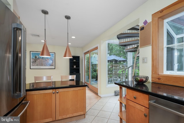 84 Cuyler Rd, Princeton, NJ 08540 - kitchen featuring appliances with stainless steel finishes, open shelves, light tile patterned flooring, decorative light fixtures, and a peninsula