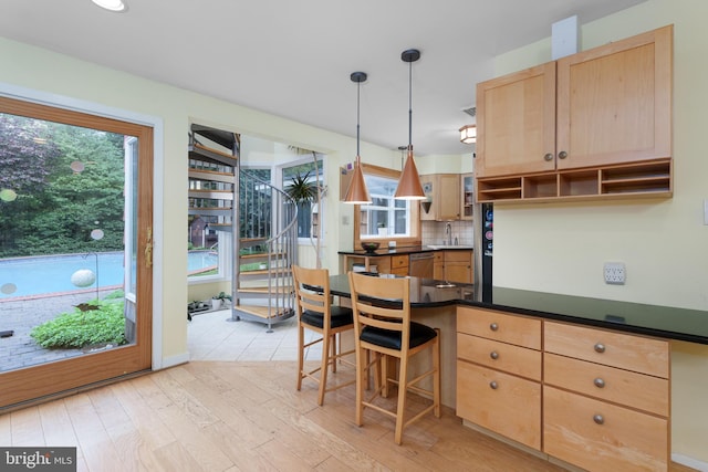 84 Cuyler Rd, Princeton, NJ 08540 - kitchen featuring open shelves, stainless steel dishwasher, dark countertops, light brown cabinetry, and healthy amount of natural light