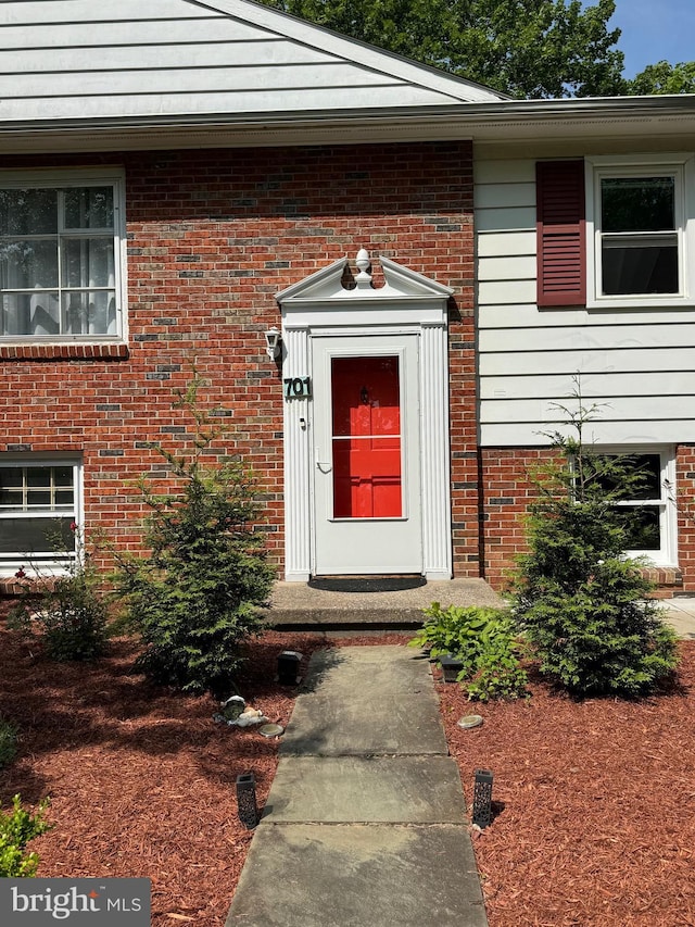 701 25th St, Huntingdon, PA 16652 - doorway to property featuring brick siding