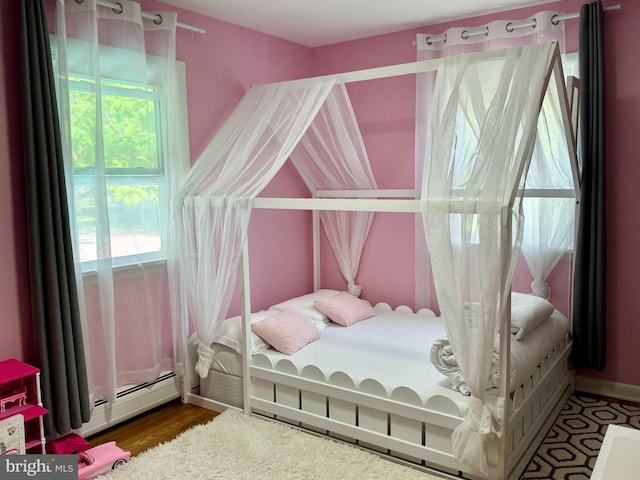 701 25th St, Huntingdon, PA 16652 - bedroom with multiple windows and wood finished floors