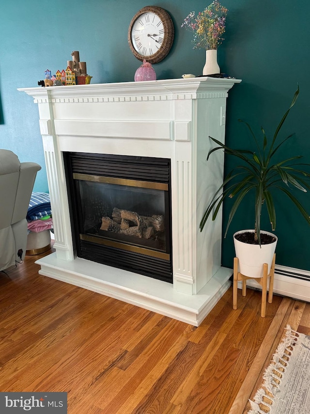 701 25th St, Huntingdon, PA 16652 - detailed view of a glass covered fireplace and wood finished floors