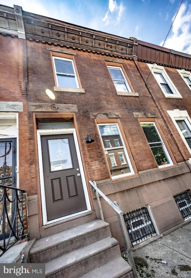 1708 S 16th St, Philadelphia, PA 19145 - doorway to property featuring brick siding