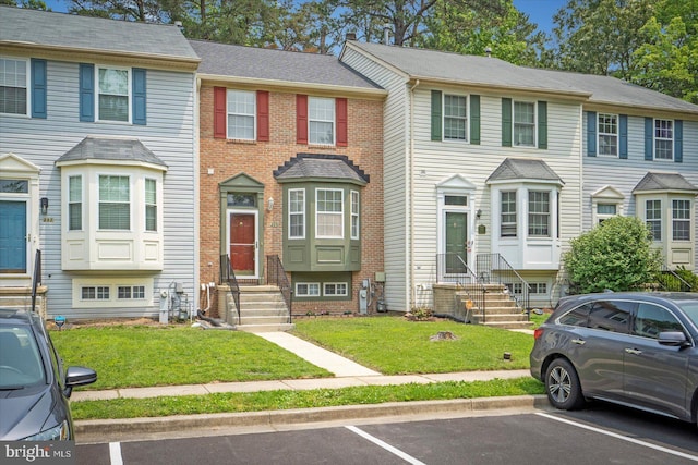 205 Quiet Ridge Ct, Pasadena, MD 21122 - townhome / multi-family property with entry steps, uncovered parking, and a front yard