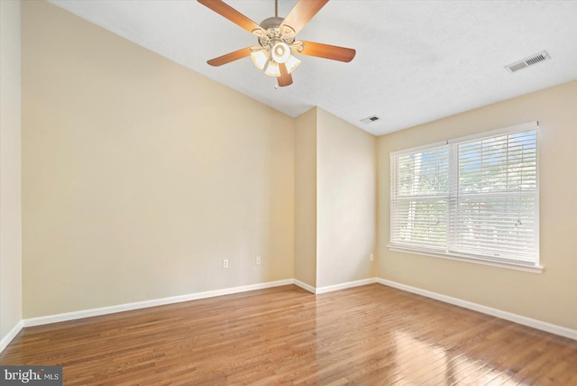 205 Quiet Ridge Ct, Pasadena, MD 21122 - spare room featuring wood finished floors, vaulted ceiling, baseboards, and ceiling fan