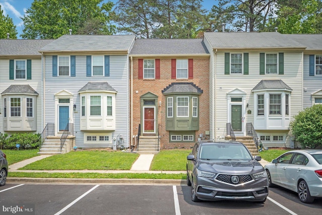 205 Quiet Ridge Ct, Pasadena, MD 21122 - multi unit property featuring entry steps, uncovered parking, and a front lawn