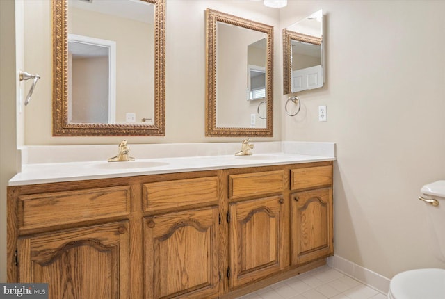 205 Quiet Ridge Ct, Pasadena, MD 21122 - bathroom featuring toilet, double vanity, tile patterned flooring, and baseboards