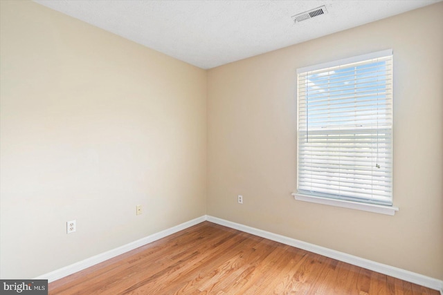205 Quiet Ridge Ct, Pasadena, MD 21122 - spare room featuring baseboards, light wood-style flooring, and plenty of natural light