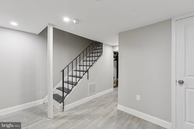 844 51st St NE, Washington, DC 20019 - staircase featuring baseboards, recessed lighting, and wood finished floors