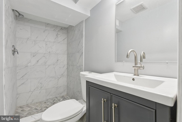 844 51st St NE, Washington, DC 20019 - full bathroom with vanity, toilet, and tiled shower
