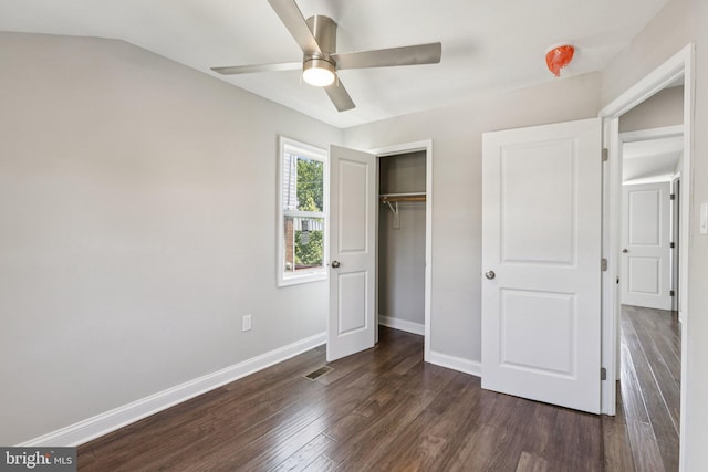 844 51st St NE, Washington, DC 20019 - unfurnished bedroom with dark wood-style floors, baseboards, a closet, and a ceiling fan