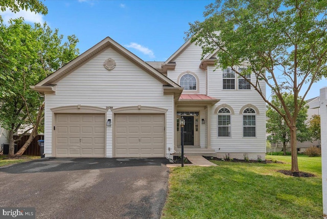 21788 Regents Park Cir, Sterling, VA 20166 - view of front of property with asphalt driveway, a garage, and a front yard