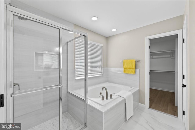 21788 Regents Park Cir, Sterling, VA 20166 - full bathroom with a bath, a spacious closet, a stall shower, recessed lighting, and marble finish flooring