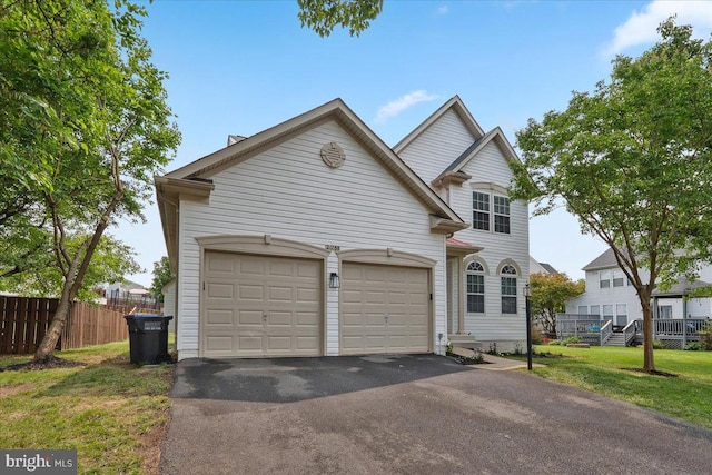 21788 Regents Park Cir, Sterling, VA 20166 - traditional-style house with asphalt driveway and a garage