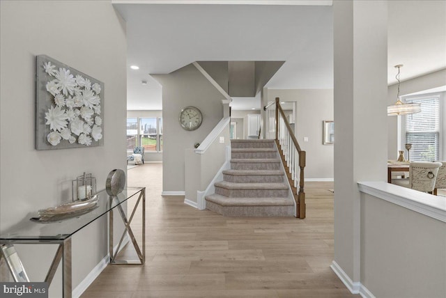 21788 Regents Park Cir, Sterling, VA 20166 - foyer with light wood-style flooring, baseboards, stairs, and recessed lighting