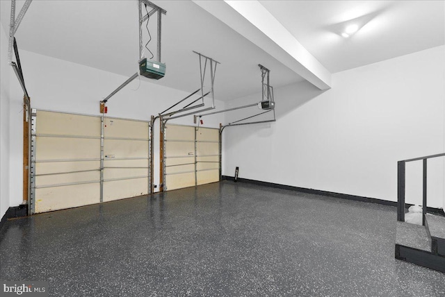 21788 Regents Park Cir, Sterling, VA 20166 - garage with a garage door opener and baseboards