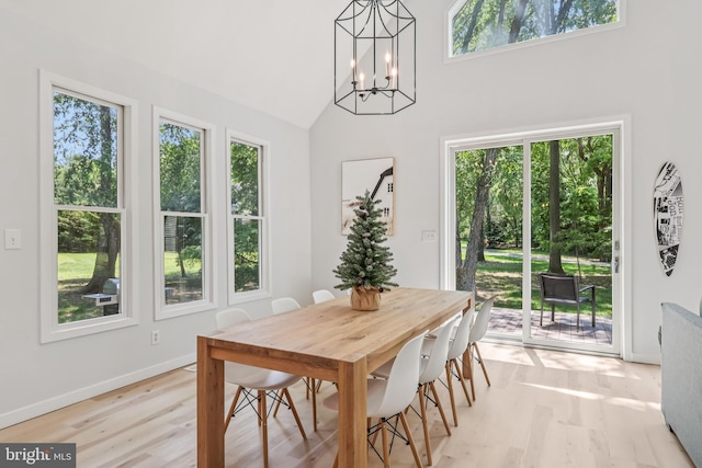 1012 Columbus Rd, Burlington, NJ 08016 - dining space with healthy amount of natural light, light wood-type flooring, a chandelier, high vaulted ceiling, and baseboards
