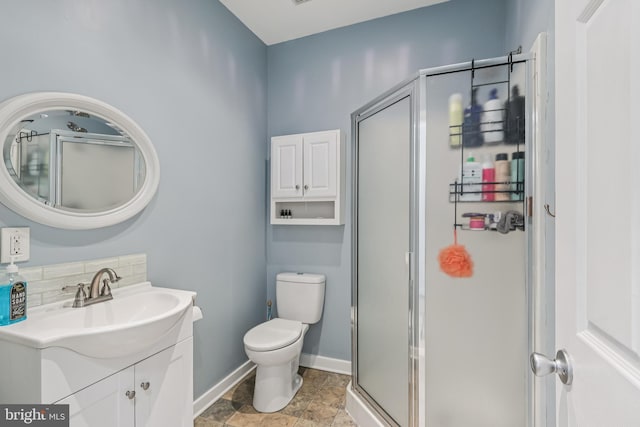 1012 Columbus Rd, Burlington, NJ 08016 - bathroom with vanity, a stall shower, toilet, baseboards, and decorative backsplash
