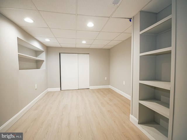 1200 First Ave, Media, PA 19063 - unfurnished bedroom with wood finished floors, a closet, recessed lighting, and a paneled ceiling