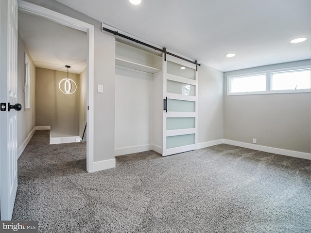 1200 First Ave, Media, PA 19063 - unfurnished bedroom with carpet, recessed lighting, a closet, and a barn door