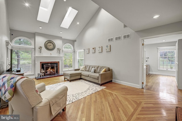 3 Monroe Ct, Plainsboro, NJ 08536 - living area with high vaulted ceiling, a brick fireplace, plenty of natural light, baseboards, and a skylight