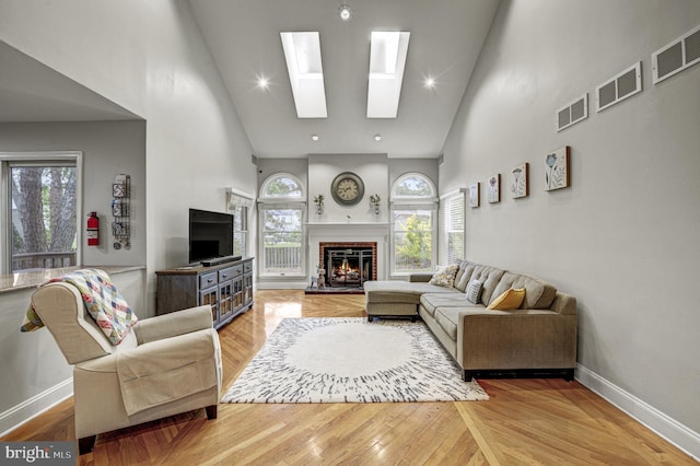 3 Monroe Ct, Plainsboro, NJ 08536 - living area featuring high vaulted ceiling, a fireplace, baseboards, and plenty of natural light