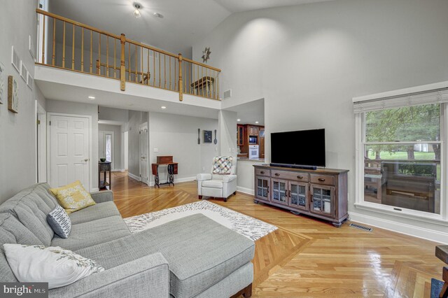 3 Monroe Ct, Plainsboro, NJ 08536 - living area with a towering ceiling and baseboards