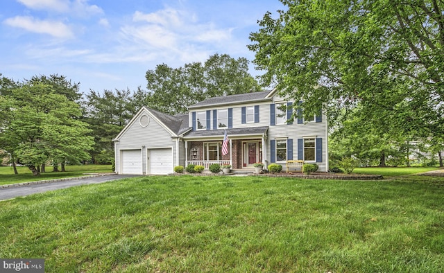 3 Monroe Ct, Plainsboro, NJ 08536 - view of front of home with covered porch, asphalt driveway, a garage, and a front lawn
