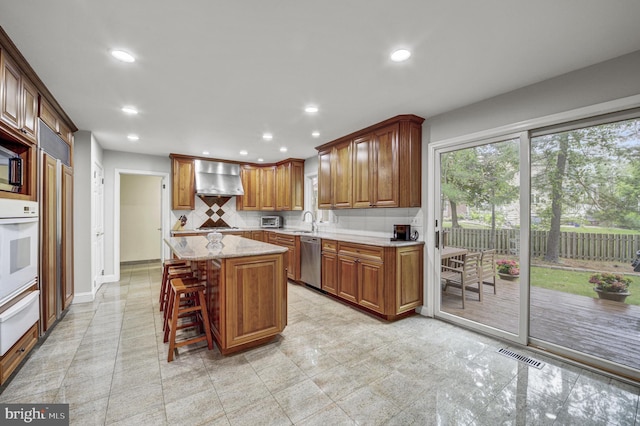 3 Monroe Ct, Plainsboro, NJ 08536 - kitchen with stainless steel dishwasher, a warming drawer, oven, recessed lighting, and a kitchen island
