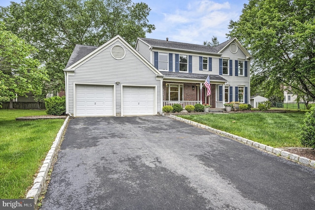 3 Monroe Ct, Plainsboro, NJ 08536 - view of front of property featuring covered porch, a garage, asphalt driveway, and a shingled roof