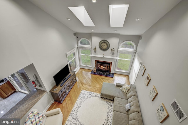 3 Monroe Ct, Plainsboro, NJ 08536 - living area featuring a towering ceiling, a fireplace, a skylight, and recessed lighting