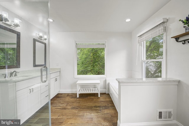 3 Monroe Ct, Plainsboro, NJ 08536 - full bath with vanity, wood finished floors, a tub to relax in, and recessed lighting