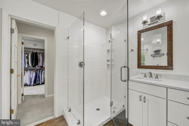 3 Monroe Ct, Plainsboro, NJ 08536 - full bath featuring a stall shower, vanity, a walk in closet, recessed lighting, and baseboards