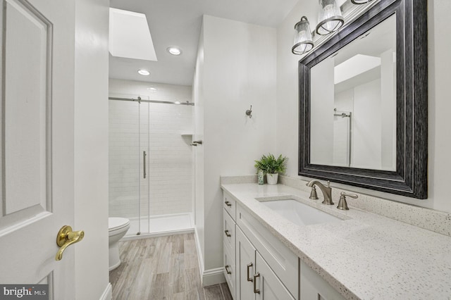 3 Monroe Ct, Plainsboro, NJ 08536 - bathroom with toilet, vanity, a stall shower, recessed lighting, and wood finished floors