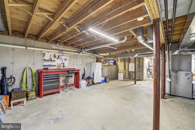 3 Monroe Ct, Plainsboro, NJ 08536 - unfinished below grade area with heating unit and a workshop area