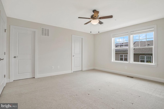 6911 Stansbury Ln, Landover, MD 20785 - carpeted spare room with ceiling fan and baseboards