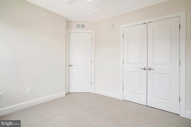 6911 Stansbury Ln, Landover, MD 20785 - unfurnished bedroom with carpet floors, baseboards, a closet, and a ceiling fan