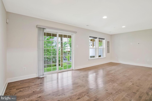 6911 Stansbury Ln, Landover, MD 20785 - empty room featuring wood finished floors, baseboards, recessed lighting, and electric panel