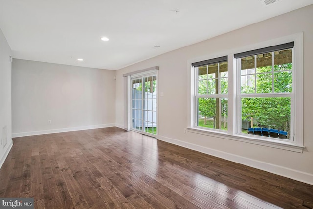 6911 Stansbury Ln, Landover, MD 20785 - empty room with baseboards, dark wood-style floors, and recessed lighting