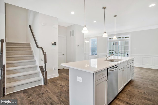 6911 Stansbury Ln, Landover, MD 20785 - kitchen featuring a sink, stainless steel dishwasher, light countertops, dark wood-type flooring, and recessed lighting