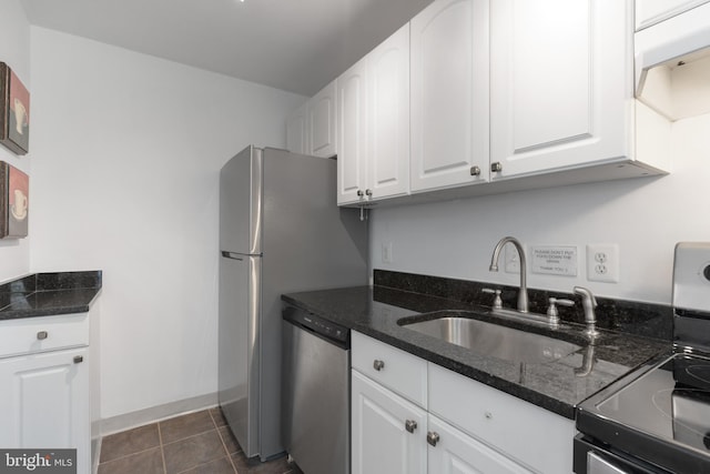 211 E Glebe Rd Unit C, Alexandria, VA 22305 - kitchen featuring stainless steel dishwasher, a sink, white cabinetry, dark stone counters, and range with electric stovetop