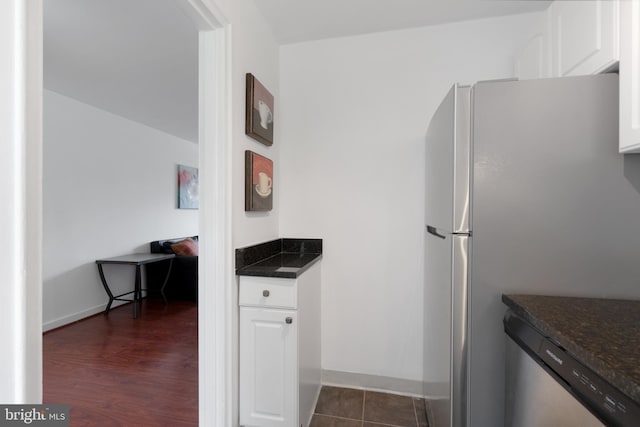 211 E Glebe Rd Unit C, Alexandria, VA 22305 - kitchen with stainless steel appliances, white cabinetry, baseboards, and dark stone countertops