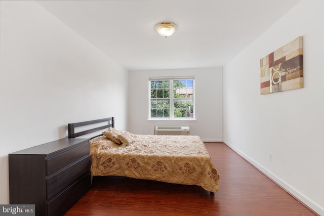 211 E Glebe Rd Unit C, Alexandria, VA 22305 - bedroom featuring dark wood-style floors, baseboards, and a wall mounted AC