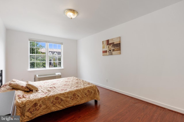 211 E Glebe Rd Unit C, Alexandria, VA 22305 - bedroom featuring wood finished floors, baseboards, and a wall mounted AC