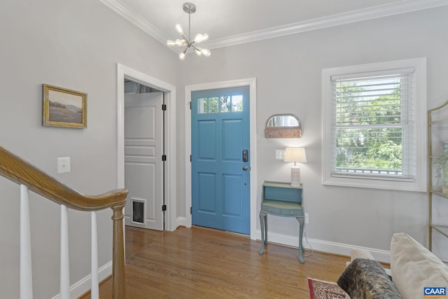1012 Locust Ln, Charlottesville, VA 22901 - entryway featuring healthy amount of natural light, ornamental molding, a chandelier, wood finished floors, and baseboards