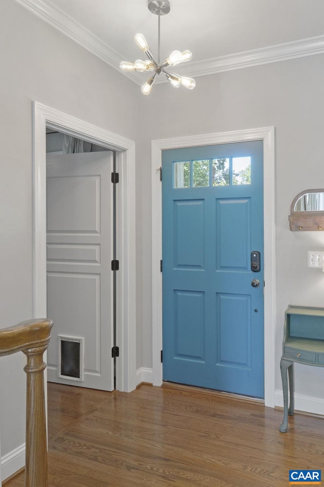 1012 Locust Ln, Charlottesville, VA 22901 - entrance foyer featuring a chandelier, ornamental molding, wood finished floors, and baseboards